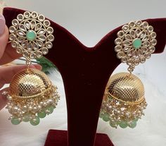 Beautiful Medium Gold Plated Jhumki | Jhumka | Perfect for Wedding , Party wear | Indian, Pakistani, Desi wedding |Holiday Gifting, Gift for her. Lightweighted Jhumka available in 3 colors. - Mint - Pink - Blue Care: It is advisable that you keep our products away from direct heat, humidity, and moisture.Please do not use Perfume on the products. Please Follow us on Instagram: https://instagram.com/krishmadesigns?utm_medium=copy_link Note: Free Shipping over $75. Contact us for any question! Green Jhumkas For Wedding And Eid, Green Cutdana Bridal Earrings For Party, Green Tilla Jhumkas For Party, Green Cutdana Jhumkas For Party, Wedding Chandbali Jhumkas With Dori Work, Chandbali Jhumkas With Dori Work For Wedding, Diwali Chandbali Jhumkas With Dori Work, Festival Chandbali Dori Work Jhumkas, Green Jhumkas For Wedding And Festive Occasions