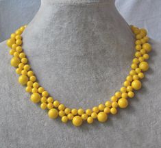 I make the flower necklace to use 6mm and 10mm yellow color glass bead.The necklace length is 16 inches .IT has a 2 inches long adjustable chain, IT is good necklace for your great wedding. I can make different type necklace to your requirements,Please feel free to contact me if you Yellow Beads Jewelry, Small Diamond Necklace, Good Necklace, Ivory Pearl Necklace, Pearl Bead Necklace, Yellow Bracelet, Beaded Necklace Designs, Pearl Necklace Wedding, Yellow Necklace