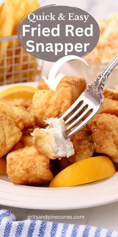 fried red snapper on a plate with lemon wedges and breadcrumbs