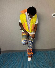 boston richey, florida rapper, colorful, flare pants, yellow vest, puffer vest, Vest inspired outfit Boston Richey, Puffer Vest Outfit Men, Black Puffer Vest Outfit, Men Vest Outfits, Gilet Outfit, Vest Outfits Men, Puffer Vest Outfit, Outfits For Guys, Vest Puffer