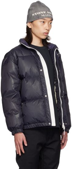 RDS-certified down-filled quilted nylon ripstop puffer jacket. Water-resistant and wind-resistant. · Stand collar · Two-way zip closure with press-stud placket · Logo printed at front and back · Welt pockets · Elasticized hem and cuffs · Adjustable press-stud fastening at side seams · Patch pocket at interior · Full taffeta lining · Logo-engraved silver-tone hardware Supplier color: Ink Supplier code: 8115446X1 Fill: 80% duck down, 20% duck feather. Sporty Down Puffer Outerwear, Sporty Down Outerwear With Padded Collar, Streetwear Quilted Nylon Jacket With Padded Collar, Quilted Nylon Puffer Jacket For Streetwear, Streetwear Quilted Nylon Puffer Jacket, Down Puffer Jacket With Padded Collar For Streetwear, Streetwear Down Puffer Jacket With Padded Collar, Sporty Down Puffer Jacket With Zipper, Sporty Down Puffer Jacket With Zipper Closure