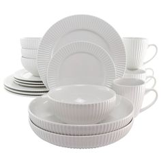 white dishes and cups are stacked on top of each other