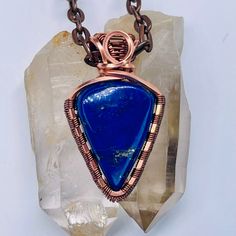 Handmade Boho Copper & Lapis Lazuli Wire Wrapped Pendant At our shop, we take pride in crafting each piece of jewelry with meticulous attention to detail. We select only the most exquisite gemstones for our pendants, and all our stones are hand-cut and polished in our on-site lapidary shop located in Coolidge, AZ. Every item is crafted from start to finish by us, Alan and Dawn, the passionate shop owners. You can find more beautiful pendants in our shop https://hippieblinghandmade.etsy.com We ho Positive Intentions, Beautiful Pendants, Protection Jewelry, Minimalist Pendant, Handmade Wire Wrapped, Spiritual Enlightenment, Handmade Wire, Psychic Abilities, Copper Plated