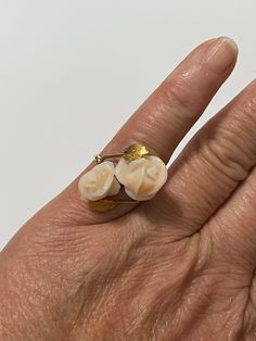 What a wonderful example of a master Coral carving. This beautiful vintage bypass ring features 2 large gorgeous carved roses places atop a 18k yellow gold setting. Leaf designs adorn the ring's shoulders. Unique piece of fine retro era organic gem jewelry, circa 1970s! ERA - Circa 1970s / Retro METAL / MATERIAL - 18k yellow gold, 2 genuine angel skin coral gem (estimated 8 carats) MARKINGS / HISTORY - N/A CONDITION - Good vintage condition. Piece has been professionally cleaned and lightly poli Vintage Rose Flower Ring For Wedding, Vintage Rose Design Flower Ring For Wedding, Vintage Rose-colored Rings For Anniversary, Vintage Rose Design Rings For Wedding, Vintage Rose Color Rings For Anniversary, Vintage Wedding Rings With Rose Design, Vintage Rose Design Wedding Rings, Roses Ring, Coral Roses