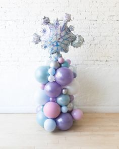 a bunch of balloons that are on top of a table