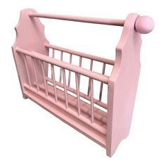 a pink baby crib on a white background with clippings to the side