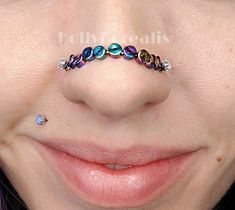 a close up of a person with a nose ring