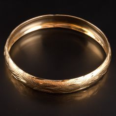 Vintage 1930's 14k Yellow Gold Etched Style Bangle Bracelet 18.1g 8" LengthMetal Information: 14k Yellow GoldTotal Weight: 18.1gWidth: 11.2mmLength: 8"Circa: 1930'sEstimated Retail Price: $2940.00OUR PRICE: $2350.0044505 Classic Yellow Gold Band Bracelet, Antique Yellow Gold Bracelet For Formal Occasions, Antique Yellow Gold Bracelets For Formal Occasions, Vintage Yellow Gold Bangle Stamped 14k, Antique Yellow Gold Bangle For Formal Occasions, Victorian Yellow Gold Bracelet For Formal Occasions, Heirloom Gold Hinged Bracelets, 14k Gold Hinged Bangle For Anniversary, Heirloom Gold Hinged Bracelet