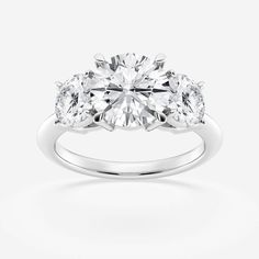 three stone engagement ring with diamond shoulders