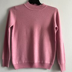 Long Sleeve High Neck Ribbed Hem Calf’s And Neck Color Pinkish Mauve 100%. Cashmere Length 23.5” Pit To Pit 18” Classic Purple Crew Neck Top, Classic Pink Winter Tops, Spring Heather Sweater, Pink Fitted Classic Sweater, Classic Pink Tops For Fall, Casual Mauve Winter Tops, Classic Purple Winter Tops, Turtleneck Tunic Sweater, Retro Sweater