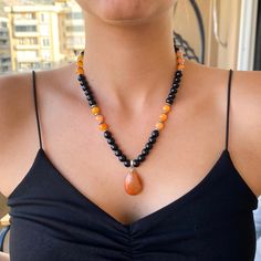 Welcome to Our Store ❤💕 ►►If you are looking for a Raindrop Orange Carnelian Necklace, this product is for you! ► Necklace ; Made from 8mm Carnelian beads and 6mm Hematite and 8mm black onyx beads and Raindrop Orange Pendant. ► When You Get The Necklace, I Will Have Sent You A Gift Bracelet. ► Our necklace and bracelet are Adjustable Macrame Necklace.  ►► Who can buy this product? ► A great option for those looking for genuine necklaces! ► A great option for those looking for an Orange Raindrop Unisex Beaded Necklace, Natural Stone Jewelry Necklace, Orange Beads Necklace, Amber Bead Necklace 8mm As Gift, Amber Necklaces With 8mm Beads For Gift, Amber Necklace With 8mm Beads For Gift, Orange Jewelry With 108 Beads For Meditation, Onyx Bead Necklaces For Meditation, Spiritual Orange Gemstone Beaded Crystal Necklace