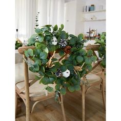 the table is set with two chairs and a potted plant