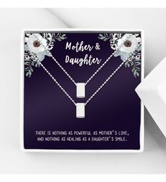 Each necklace comes in a Anavia gift box and can come with a custom gift message card to your recipient. | ● Card comes with a message card. ● Card Design: Purple with flower pattern on the top corner and message on the bottom. ● Card Recipient: "Mother & Daughter" ● Card Message: "There is nothing as powerful as mother's love and nothing as healing as a daughter's smile." ● Includes 2 infinity ring necklaces, one for mother and one for daughter. ● Pendant Available Colors: Silver, Gold, and ros Mother Daughter Necklaces, Rose Gold Infinity Ring, Mother Daughter Necklace, Cube Necklace, Mother's Love, Mother Daughter Gifts, Daughter Necklace, Infinity Ring, Delivery Gifts