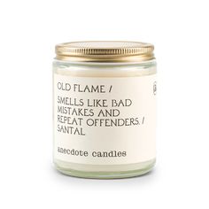 a candle that says old flame, smells like bad makes and repeats offenders / santal