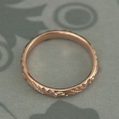 This is one of my new favorite designs! It's a lovely swirl flourish pattern that encircles the entire band. This is a deep detailed design--so elegant and pretty. You won't be disappointed. The band measures 3mm wide by 1.5mm thick making it a nice substantial band to last a lifetime and then some! Your ring will be hand made to size just for you in solid 14K gold (rose, yellow, or white). Blazer Arts is a family-owned and operated small but growing business that first opened up shop on Etsy in Rose Gold Rings With Decorative Band For Wedding, Heirloom Rose Gold Stackable Wedding Rings, Rose Gold Engraved Wedding Ring, Round Band, Wedding Rings With Intricate Design, Rose Gold Engraved Ring With Intricate Design For Wedding, Adjustable Stackable Wedding Rings With Intricate Design, Rose Gold Engraved Ring For Wedding, Adjustable Stackable Rings With Intricate Design For Wedding, Luxury Engraved Adjustable Wedding Ring