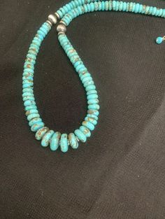 sterling silver turquoise bead necklace .The necklace measures 18 inches Turquoise Multi-strand Beaded Necklace As Gift, Unique Hand-strung Turquoise Beaded Necklace, Hand-strung Turquoise Necklace With Sterling Silver Round Beads, Adjustable Turquoise Beaded Nickel-free Necklace, Adjustable Southwestern Hand-strung Turquoise Necklace, Sterling Silver Bead Bracelet, Turquoise Bead Necklaces, Silver Bead Bracelet, Wide Bands