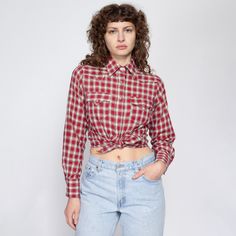 Vintage 70s western pearl snap shirt in a unique red, green, and white plaid, with lines of embroidered thread that give it texture. Measurements and Condition: Fits like: Women's medium (has a slightly petite fit) Fabric: Feels like cotton/poly Brand: Rockmount Ranch Wear, made in USA Condition: Excellent Length: 25" in front, 26" in back Chest: 39" Waist: 36" Shoulders (seam to seam): 14" Sleeve: 24" Shown on a 5'8" model with measurements of 34"-26"-37", usually wears a size small. See our FA Fitted Plaid Western Tops, Fitted Western Plaid Tops, Vintage Collared Tops For Rodeo, Plaid Shirt For Rodeo In Fall, Casual Plaid Tops For Rodeo, Retro Collared Tops For Rodeo, Vintage Shirt For Rodeo In Fall, Spring Western Red Tops, Western Red Tops For Spring