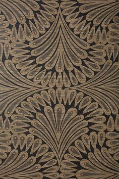 an intricate design on black and gold fabric