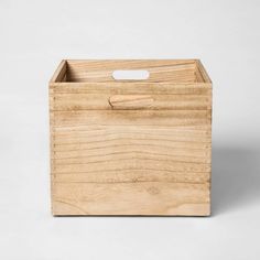 a wooden box with handles on a white background