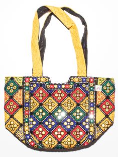 Discover Sindhi Artistry with this vibrant embroidered tote bag. Crafted with meticulous beadwork and mirror accents, it reflects the rich cultural heritage of Sindhi artisans. Made from durable fabrics, this one-of-a-kind bag is both stylish and functional. The spacious interior and sturdy crossbody strap make it perfect for everyday use. Add a touch of ethnic charm to any outfit with this unique accessory. Bohemian Bags With Dori Work, Festive Bohemian Bag With Dori Work, Multicolor Embroidered Potli Bag With Handwork For Festivals, Rectangular Handwork Festival Bag, Festive Bohemian Bags With Dori Work, Festive Rectangular Potli Bag With Mirror Work, Festival Rectangular Bags With Multicolor Embroidery, Multicolor Handwork Bags For Festive Occasions, Multicolor Potli Bag For Daily Use