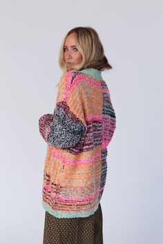 Wrap yourself in warmth with the Cross Creek Cardigan. These captivating colors will keep you cozy all year long! You're going to love this cardigan because it features: So cozy chunky knit fabric with an eye-catching multi color print throughout Loose and slouchy cardigan silhouette Classic open front closure Dropped shoulders with loose long sleeves Ribbed trim along the edges and wrist closures Pair with: Pacific Distressed Wide Leg Jeans, and Scoop Neck Bralette Tee for a casual look, or On Multicolor Acrylic Sweater For Fall, Casual Multicolor Chunky Knit Outerwear, Trendy Multicolor Winter Sweater, Trendy Multicolor Soft Knit Sweater, Multicolor Knitted Cardigan For Fall, Multicolor Sweater Coat For Fall, Multicolor Soft Knit Cardigan For Fall, Fall Multicolor Soft Knit Cardigan, Multicolor Long Sleeve Sweater Coat For Fall