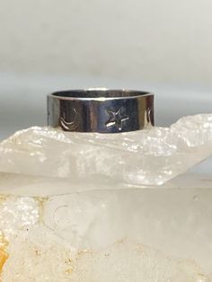 "Stars Moon ring celestial band sterling silver women men Size. 12 Weight 5.4g Band Width. 5/16\" Free Shipping & Free Postal Insurance Delivered in a Gift Box If you do not want the ring polished and want to leave the natural patina please let me know at the time of purchase as I do polish rings before I ship rings out. Thanks Free First Class shipping and postal insurance is included. If you want to upgrade to priority kindly pay an additional fee to do so. This is recommended if you would Celestial Silver Ring With Moon Phase, Silver Star-shaped Celestial Midi Rings, Celestial Silver Midi Rings For Anniversary, Celestial Silver Midi Promise Rings, Celestial Silver Star Midi Rings, Symbolic Silver Star-shaped Ring, Celestial Silver Rings Stamped 925, Celestial Silver Crescent Ring, Celestial Crescent Silver Ring