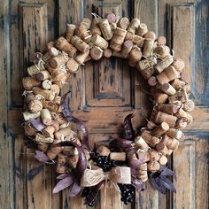 a wreath made out of wine corks on a door