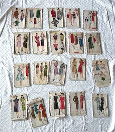 nine vintage sewing patterns are laid out on a sheet