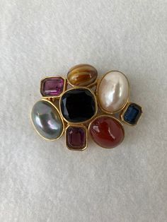 "Measuring 1 1/3\" wide this whimsical brooch is 1 1/2\" tall. It is in excellent condition and is clearly marked on the back." Formal Multicolor Gemstone Brooches, Elegant Oval Multi-stone Brooches, Elegant Multi-stone Oval Brooches, Elegant Multi-stone Oval Brooch, Antique Multi-stone Brooches For Formal Occasions, Elegant Multi-stone Collectible Brooches, Formal Gold Multi-stone Brooches, Gold Multi-stone Brooches For Formal Occasions, Gold Multi-stone Brooch For Formal Occasions