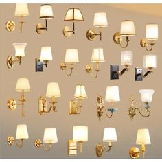 a bunch of lamps that are on the wall