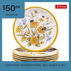 a set of four yellow and white plates with flowers on them are $ 50 each