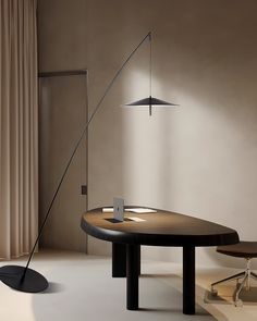 a table with a lamp next to it and a chair in front of the table