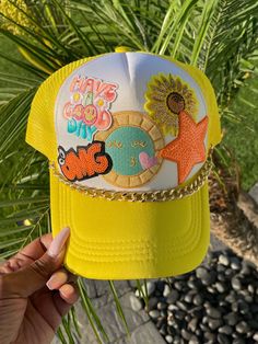 Brighten up your summer with our "Have a Good Day" Trucker Cap! This trendy, custom cap features a cheerful yellow design with a cool sunshine patch theme, perfect for spreading positivity. Adorned with a multi-color sequin star, this fun trucker hat is a stylish addition to any outfit. Ideal for sunny days and outdoor adventures, this cap ensures you stay cool and comfortable while making a statement. Details: Design: "Have a Good Day" with sunshine patch and multi-color sequin star Color: Vibrant yellow Material: High-quality, breathable fabric Fit: Adjustable snapback for a comfortable fit Uses: Perfect for summer, outdoor activities, and casual wear Special Feature: Customizable for a unique touch Stay trendy and spread good vibes with this fun trucker hat, and make every day a good da Cheap Yellow Snapback Trucker Hat, Fun Summer Baseball Cap With Curved Brim, Playful Summer Visor Hat, Fun Summer Baseball Cap With Visor, Fun Summer Visor Baseball Cap, Trendy Multicolor Snapback Hat With Curved Brim, Summer Multicolor Baseball Cap With Curved Brim, Multicolor Summer Baseball Cap With Curved Brim, Trendy Summer Baseball Cap With Flat Brim