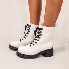 - Zip closure along the side - Lace-up ties - Vegan leather material - True to size Combat Boot, Dr. Martens Boots, Leather Material, Combat Boots, Vegan Leather, Lace Up, Boots, Lace, Leather