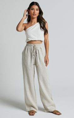 Effortlessly chic and oh-so-comfy, our Tilly Pants are the ultimate go-to for fashion-forward babes on the move. Crafted from a lightweight and breathable linen blend, these relaxed pants offer a flattering silhouette that will keep you looking stylishly put-together. The elasticated drawstring waist ensures a perfect fit every time, while the neutral beige shade adds versatility to your wardrobe. Whether you're dressing them up with heels or keeping it casual with sneakers, these full-length beauties are guaranteed to elevate any outfit. Made from polyester, they combine style and comfort in one fabulous package. Embrace your individuality and conquer your day in our Tilly Pants!Product Details:Relaxed fit pantsCasual styleFull lengthMade from polyester fabricMaterial and CarePolyesterLow Beige Linen Lounge Pants, Full-length Linen Pants For Vacation, Non-stretch Linen Pants For Loungewear, Non-stretch Linen Wide Leg Pants For Loungewear, Relaxed Fit Linen Wide-leg Parachute Pants, Relaxed Pants, Neutral Beige, Linen Pants, Drawstring Waist