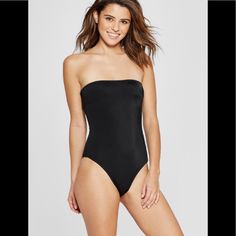 Xhilaration Women’s Ribbed Bandeau Tube One Piece Swimsuit Color: Black Size: Xs Black Strapless Shapewear Bodysuit, Strapless Black Seamless Bodysuit, Black Strapless Seamless Bodysuit, Black Bandeau Stretch Bodysuit, Black Strapless Stretch Bodysuit, Black Stretch Bandeau Bodysuit, Black Bandeau Bodysuit With Lined Body, Black Bandeau Bodysuit For Night Out, Strapless Seamless Party Bodysuit