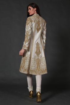 Editor's Note Ivory Chanderi Silk Kurta Comes With Dupatta & Churidar Color: Ivory Fabric: Chanderi Care: Dry Clean Only About the Designer Rohit Bal is intensely concerned with design as an art form. The designer draws on history, fantasy and folklore to create masterpieces that are desired by discerning aficionados around the globe. Rohit has a deep understanding of the psyche of the fashion world and it reflects in his collections that are intelligent, studied, imaginative and completely inno Luxury Gold Chanderi Churidar, Luxury Gold Chanderi Dress, Luxury Gold Churidar In Art Silk, Silk Kurta Set, Asian Dresses, Pakistan Dress, Silk Kurti, Rohit Bal, Pakistani Wedding Outfits