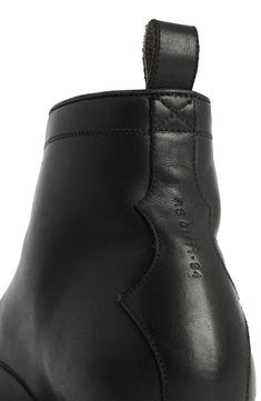 Crisp, monochrome design refines this cap-toe combat boot crafted from premium leather above a rugged rubber sole. 5" shaft Lace-up style Leather upper and lining/synthetic sole Made in Portugal Leather Lace-up Boots With Reinforced Heel For Work, Urban Black Leather Combat Boots, Ankle-high Leather Lace-up Boots For Streetwear, Black Leather Urban Combat Boots, Black Casual Lace-up Boots With Leather Lining, Urban Leather Waterproof Boots, Urban Leather Combat Boots With Round Toe, Urban Leather Combat Boots For Streetwear, Urban High-top Leather Combat Boots