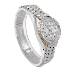 One 1967 Ladies Rolex 24mm Vintage Bark Finish Solid 18K White Gold Watch with Mother of Pearl Diamond Dial in Bark Finish. Pre-Owned SN# 159**** Year: 1967. Brand: Rolex. Model: 6517. Crystal: Plastic. Gender: Women's. Condition: Very Good. Case Dimensions: 24mm. Dial: Mother of Pearl Diamond. Bracelet Size: Fits Max 6.0" Wrist. Metal Type: 18K Solid White Gold. Bracelet / Strap: 18K Solid White Gold. Movement: Self-Winding (Automatic). Box / Certification: Rolex Box / Certificate of Authentici Classic Diamond Watch With Jubilee Bracelet, Formal Jubilee Bracelet Watch Accessory, Silver Formal Watch Bands, Silver Watch Bands For Formal Occasions, Formal Silver Watch Bands, Classic White Watch With Jubilee Bracelet, Classic White Watches With Jubilee Bracelet, Classic Watch Bands With Polished Finish, Classic Round Watches With Jubilee Bracelet