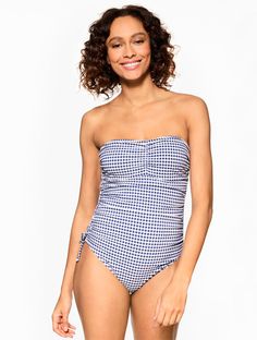 A bold gingham print makes this Sun Ocean Sand one-piece swimsuit an instant favorite. Crafted with a playful tie front and adjustable straps for extra support. The perfect pool or beach day essential. Find your perfect fit. Get free return shipping on all swimsuits. Features Free return shipping on all swimsuits One Piece Lined Soft Cup Adjustable & Removable Straps Sun Ocean Sand Imported Material: Body: 85% Nylon, 15% Spandex; Lining: 92% Polyester, 8% Spandex Care: Hand Wash Cold; Do Not Wri Gingham Swimwear For Sunbathing In Spring, Spring Gingham Swimwear For Sunbathing, Gingham Swimwear For Sunbathing, Gingham Swimwear For Beach Season Sunbathing, Gingham Swimwear For Sunbathing In Beach Season, Summer Gingham Swimwear For Pool, Gingham Swimwear For Poolside And Beach Season, Swimsuits One Piece, Ocean Sand