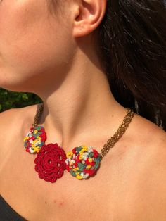 "\"Amelie\" handmade crochet necklace. A statement piece of jewellery that will brighten up your outfit.  Flowers width: 4cm, 5cm, 4cm  Flowers length: 13.5cm  Colour can be personalised - please  message me with your preferences for each of the flowers. Available Colours : Bordeaux, Multicolour" Handmade Bohemian Choker Necklace, Bohemian Crochet Necklaces For Festivals, Bohemian Crochet Necklace For Festivals, Adjustable Crochet Necklaces For Festivals, Adjustable Crochet Necklace For Festivals, Multicolor Crochet Bohemian Jewelry, Handmade Red Bohemian Necklace, Handmade Pendant Necklaces For Festivals, Unique Crochet Jewelry As A Gift