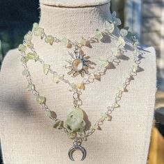 "Wire Wrapped Prehnite Silver Necklace/Crystal Choker/Gemstone Jewelry/Crystal Necklace/Sun/Moon Charm Crystal Necklace/Hippie Hippy Choker - Choker style crystal necklace with Prehnite Crystal chip beads and sun, moon or stone charms - Length is 15\", 16\", 17\", 18\", 19\"  - Materials: Silver plated copper wire, natural Labradorite crystals and, brass charms Check other styles in my shop: https://www.etsy.com/listing/1495642204/carnelian-sun-charm-wire-wrapped-gold?click_key=5364a45620b83233c Crystal Wrap Necklace, Bohemian Crystal Necklace For Festivals, Summer Crystal Jewelry As A Gift, Adjustable Crystal Jewelry For Summer, Green Bohemian Crystal Jewelry, Bohemian Green Crystal Jewelry, Green Spiritual Crystal Necklaces For Festivals, Spiritual Green Crystal Necklaces For Festivals, Green Spiritual Crystal Necklace For Festival