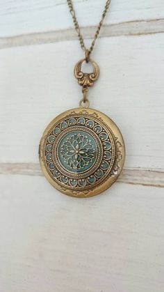 For yourself or someone you love... Timeless and classic, this gorgeous Antique brass filigree locket will become a special addition to your jewelry collection. The locket opens to the side to reveal two places, Glue on photo or keep a secret note locked away, close to your heart. ADDING PHOTOS: The option to add photo/photos means that I will be the one who will resize, crop, print, and insert the photo/photos inside the locket. Once you purchase this listing and you choose to add one photo or Handmade Antique Gold Brass Locket Necklace, Bohemian Nickel-free Pendant Locket Necklace, Antique Gold Locket Jewelry For Vintage Collection, Vintage Antique Gold Locket Necklace Pendant, Antique Gold Vintage Locket Necklace Pendant, Vintage Antique Gold Pendant Locket Necklace, Handmade Antique Bronze Locket Necklace, Antique Filigree Round Pendant Locket Necklace, Antique Filigree Medallion Locket Necklace