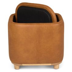 a brown leather chair with a black cushion on it's back and wooden legs