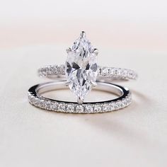 an oval cut diamond ring with pave band