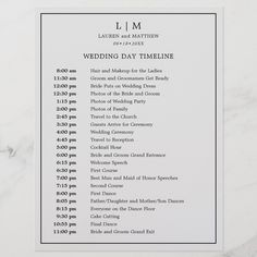 the wedding day schedule card is shown on a marble surface with white lettering and black ink