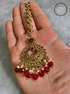 We are thrilled to introduce our exquisite collection of Indian earrings in Maroon color. These stunning earrings are crafted to enhance your style, whether you're attending a party or a wedding ceremony. They are guaranteed to make you stand out in the crowd.Elevate your style with these stunning Earrings. Make a bold fashion statement and turn heads wherever you go. Shop our stunning collection today!We have a wide range of colors available, so be sure to check our other listings to find the perfect match for your style. In addition to this earring, we have a wide variety of Indian Pakistani jewelry. Explore our shop to discover the perfect piece for your collection. If you're having trouble viewing our photos, try increasing your screen brightness for a clearer image.We aim to dispatch Festive Gold Plated Tikka As A Gift, Elegant Plug Earrings For Festive Celebration, Elegant Festive Celebration Plug Earrings, Handmade Elegant Alloy Earrings, Traditional Red Gold-plated Bridal Earrings, Elegant Metal Chandbali Bridal Earrings, Handmade Alloy Earrings For Party, Elegant Chandbali Bridal Earrings In Metal, Gold Plated Chandbalis For Celebration