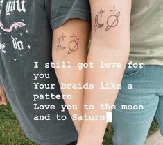 two people holding hands with tattoos on their arms that say i still got love for you your braids like a pattern love you to the moon and to saturn