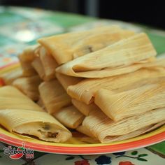 some dumplings are stacked on a plate and ready to be eaten