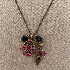 This Handmade Sweet Charm Necklace Is On Trend For This Season With Garnet And Pink Stones. It Features Both A Hamsa Hand And An Evil Eye For Extra Good Luck! Both Symbols Are Meant To Bring Good Fortune And Protection To Their Wearers. 24k Gold Electroplated Over Brass, Chain Adjustable 16″-20″ And Pendant 0.75” Long, Lobster Claw Clasp. In Excellent, Never Worn Condition. Handmade Pink Charm Necklaces, Bohemian Pink Jewelry With Vintage Charm, Pink Bohemian Jewelry With Vintage Charm, Bohemian Pink Adjustable Charm Necklaces, Pink Bohemian Charm Necklace Gift, Bohemian Pink Charm Necklace, Hamsa Charm, Pink Stones, Hamsa Hand